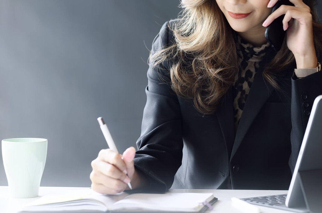 Businesswoman using cellphone